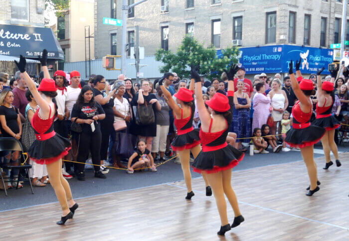 Young dancers entertain the crowd at the annual summer stroll.