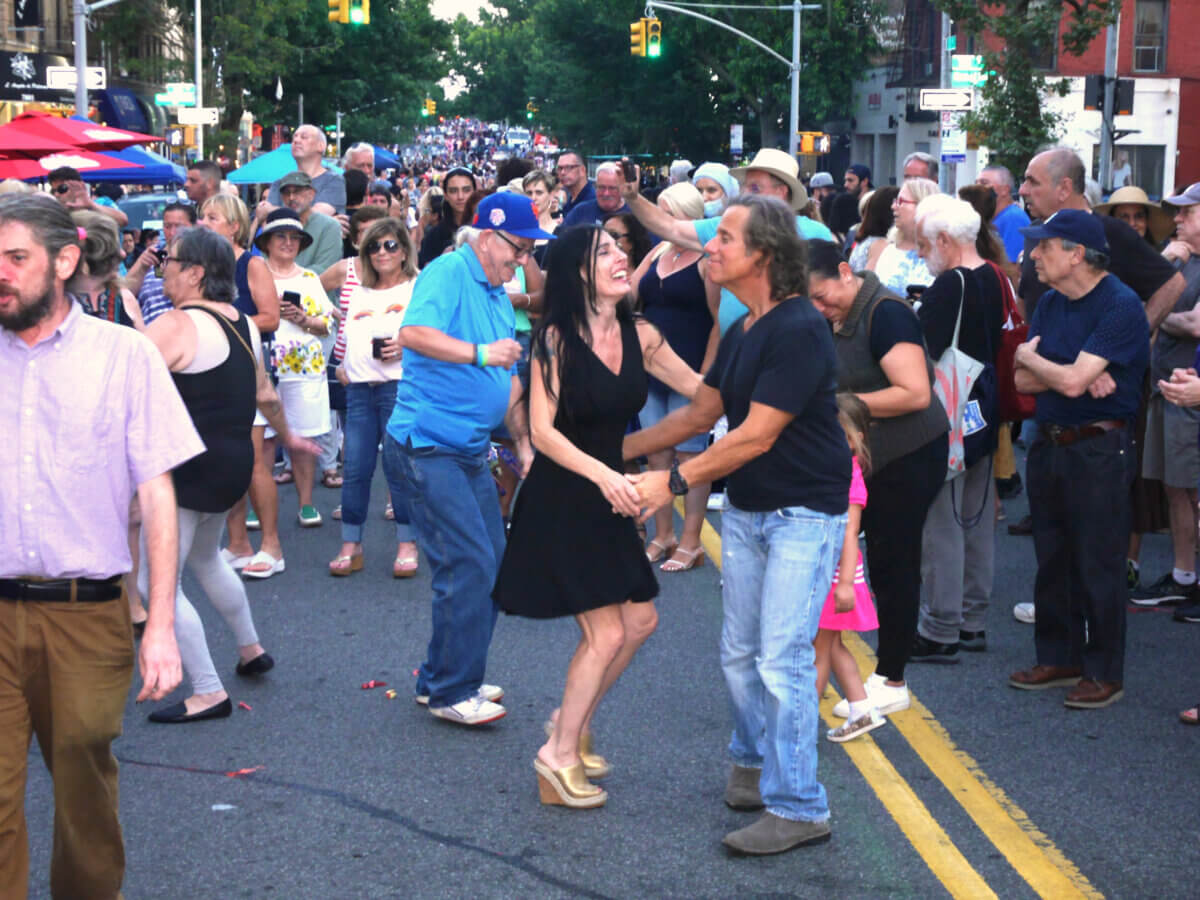 people dancing at summer stroll on third avenue
