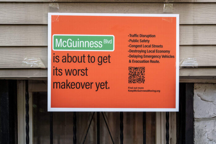 mcguinnness boulevard orange sign