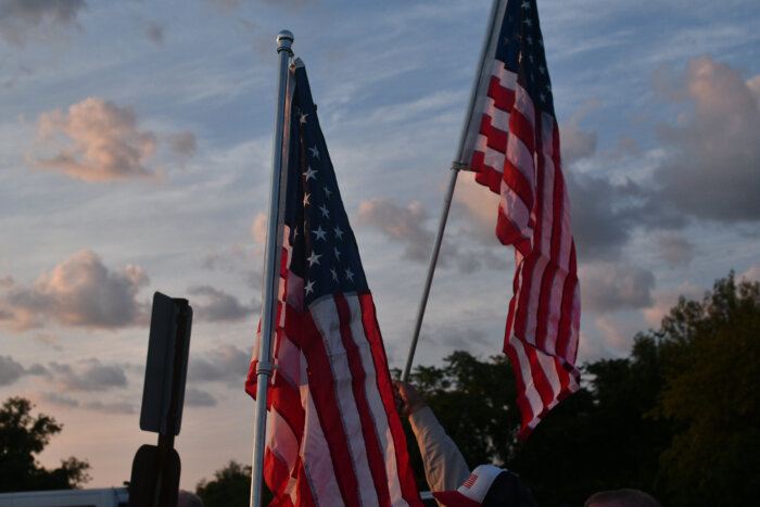 american flags at floyd bennett field protest