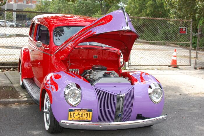 Owners of a bright red and purple beauty showed off their engine at the annual car show.