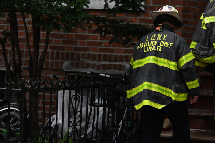 firefighter on scene of lithium-ion battery fire