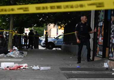 An officer from 75 precinct watched over the scene as the victim was treated.