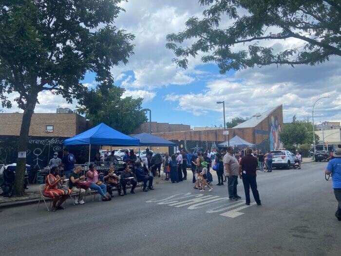 Officers barbecue for visiting community members outside the 83rd Police Precinct in Bushwick for the annual National Night Out Celebration.