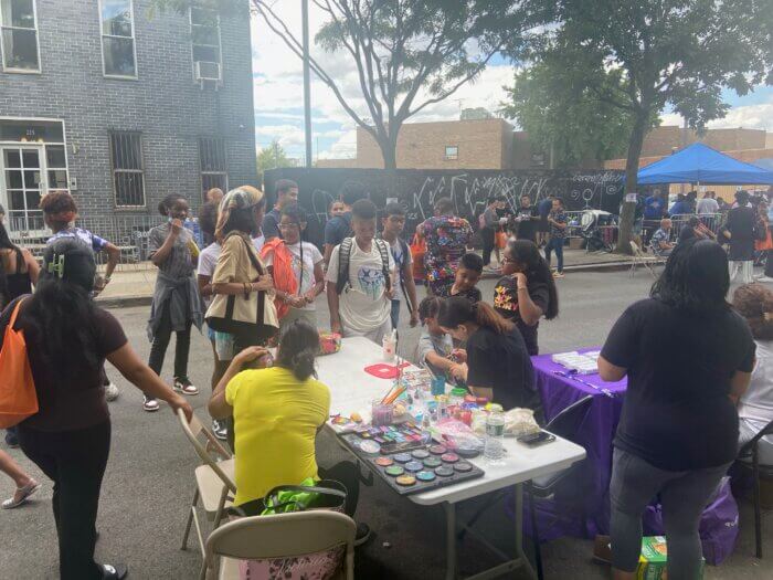 Kids lining up to get their faces painted at the 83rd Police Precinct's National Night Out celebration in Bushwick.