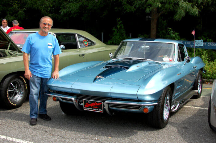 Frank Nacaratta poses with his blue Corvette.