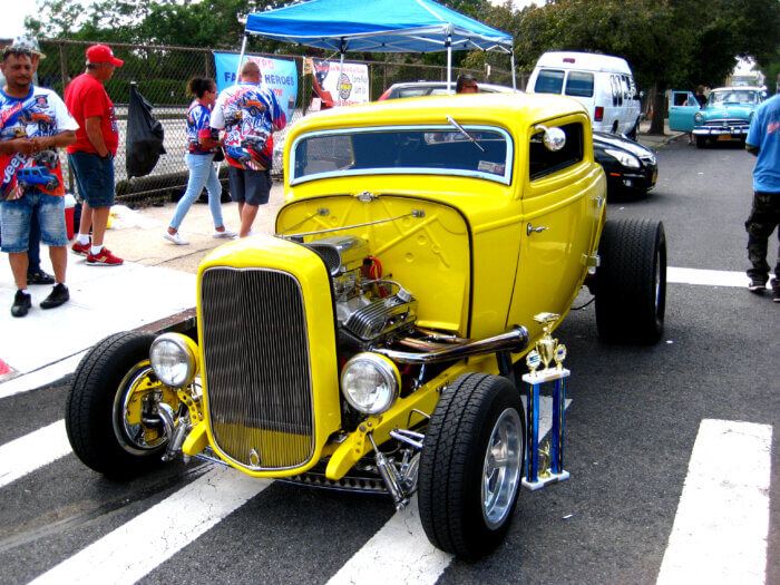 Owners of a yellow coupe took home a trophy for their shiny and bright car.