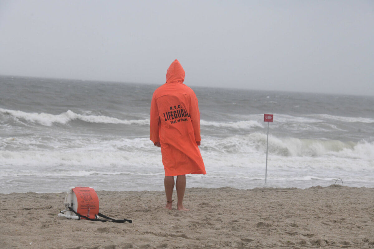 lifeguard standing on beach coney island