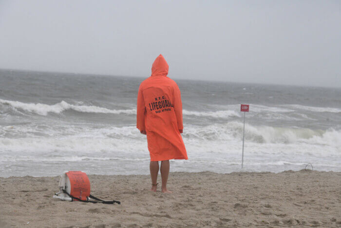 lifeguard standing on beach coney island