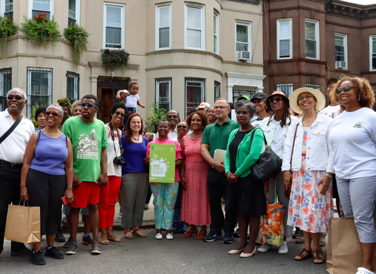 people pose after winning greenest block in brooklyn
