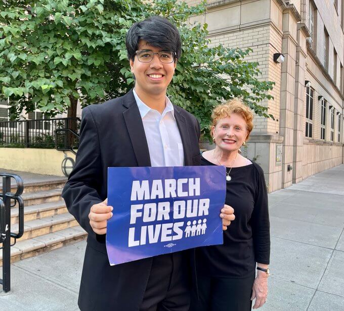 jo anne simon with student and march for our lives sign
