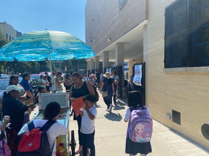 Students and their parents grab some ice cream after a hot first day of school at P.S. 174 Kosciusko in Bushwick.