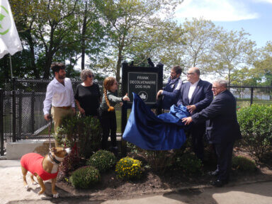 The Decolvenaere family and city officials gathered at the new dog run