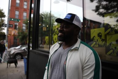 man outside his store in North Brooklyn