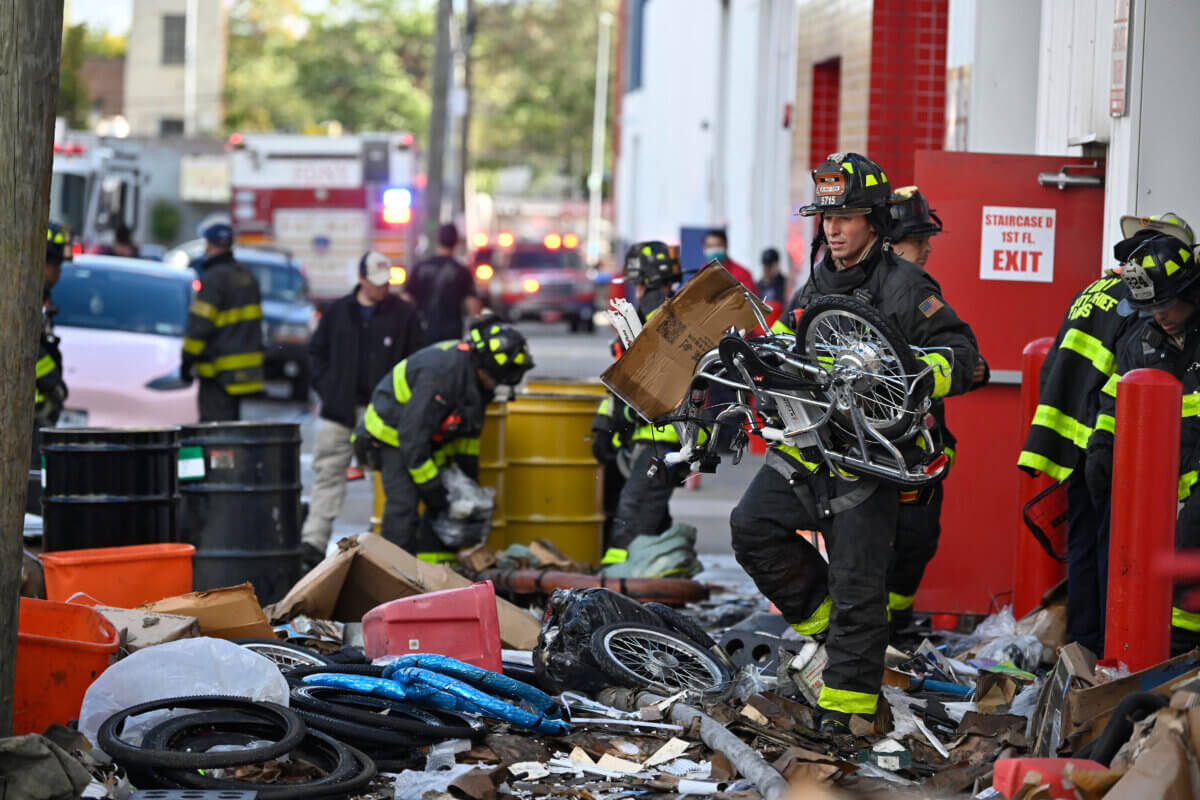 firefighter with e-bike on scene of fire