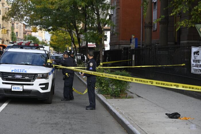 Officers of the 79th police precinct at the scene of a shooting in Bedford-Stuyvesant.