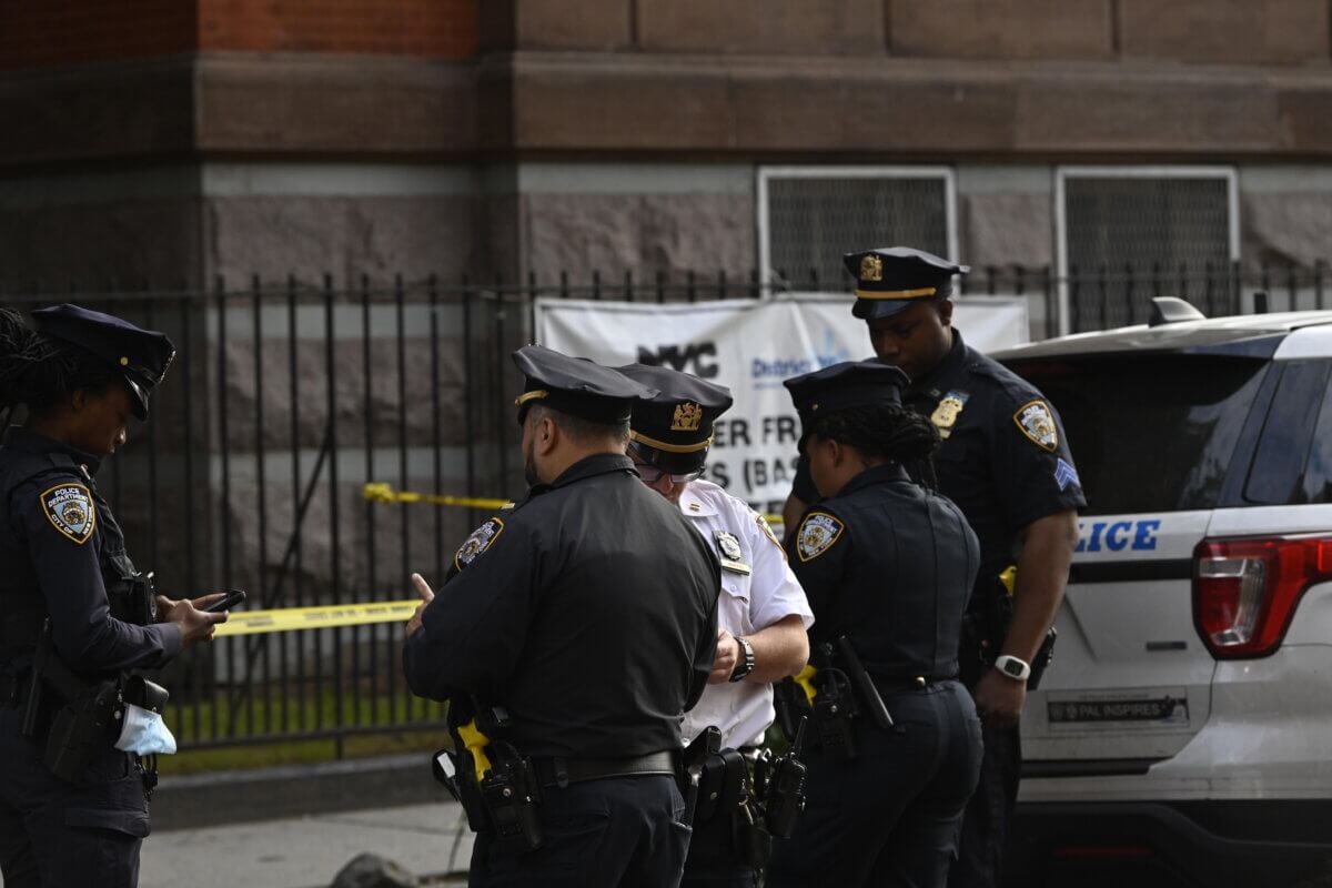 Officers of the 79th police precinct at the scene of a shooting in Bedford-Stuyvesant.