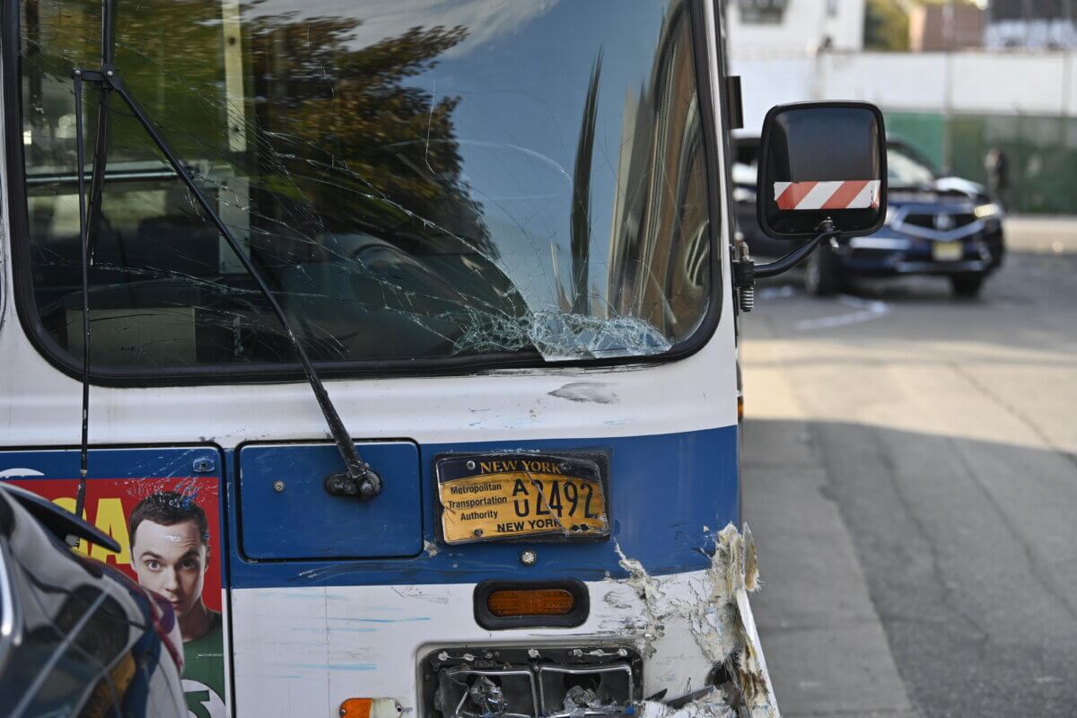 Cops took one person into custody for their alleged involvement with a crash involving two MTA buses.