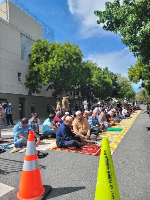 men praying at Kensington mosque