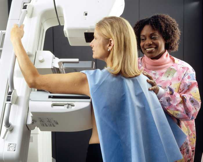 woman getting mammogram