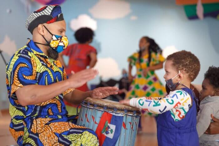kid drumming at Brooklyn Children's Museum