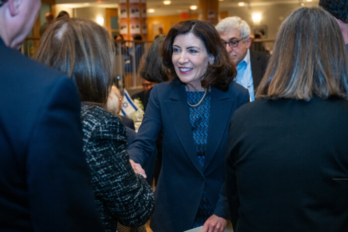 Gov. Kathy Hochul shakes hands after her speech denouncing antisemitism on Sunday.