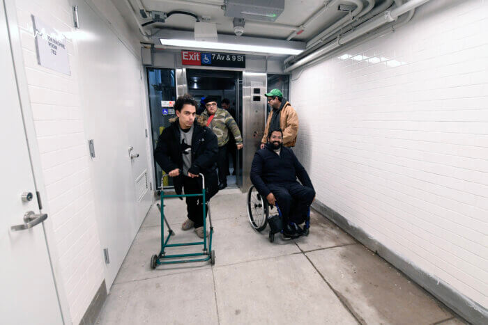 people on 7th avenue elevators