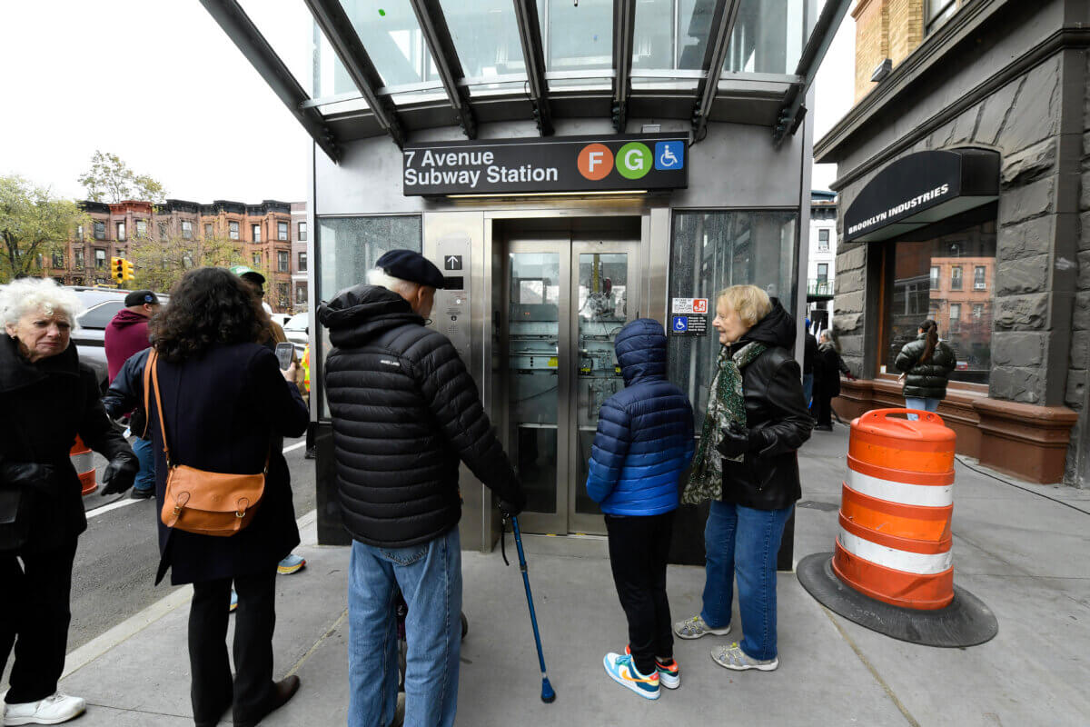 people wait for the elevator at the 7th avenue station