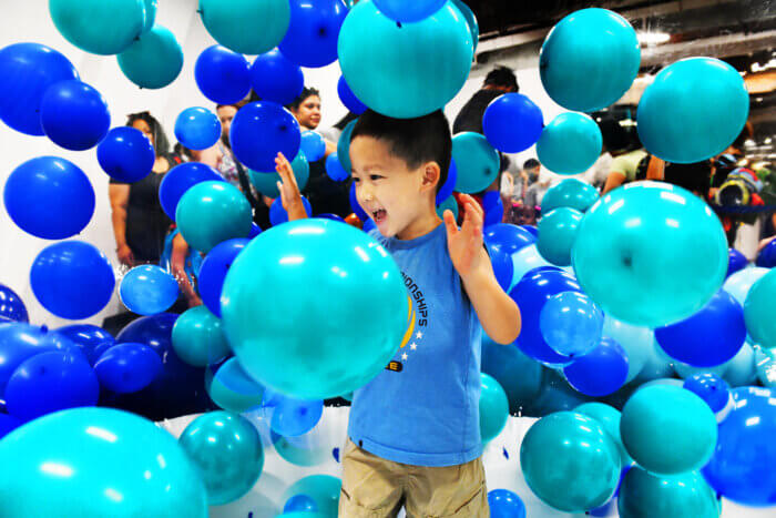 kids with balloons at brooklyn navy yard holiday market