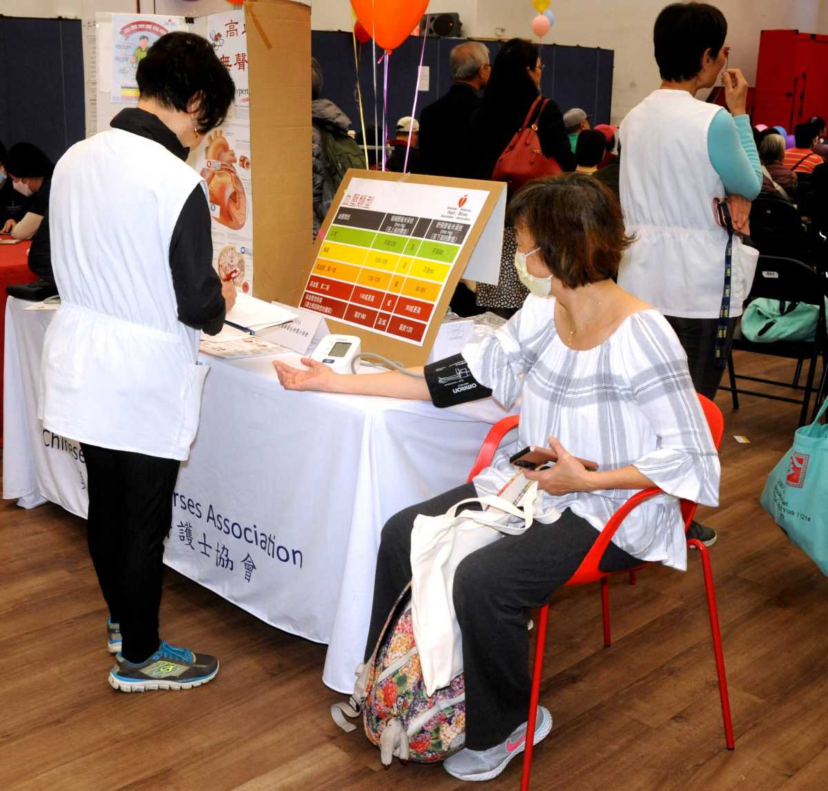 woman getting blood pressure taken at centerlight health fair