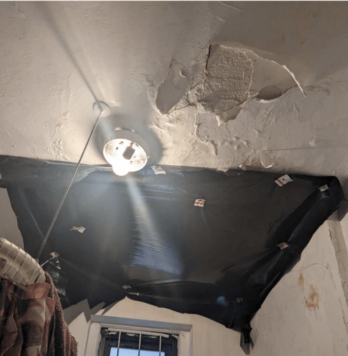 When tenants told the superintendant about the sewage leak, they allegedly nailed a plastic sheet to the ceiling and neglected any further maintenance.