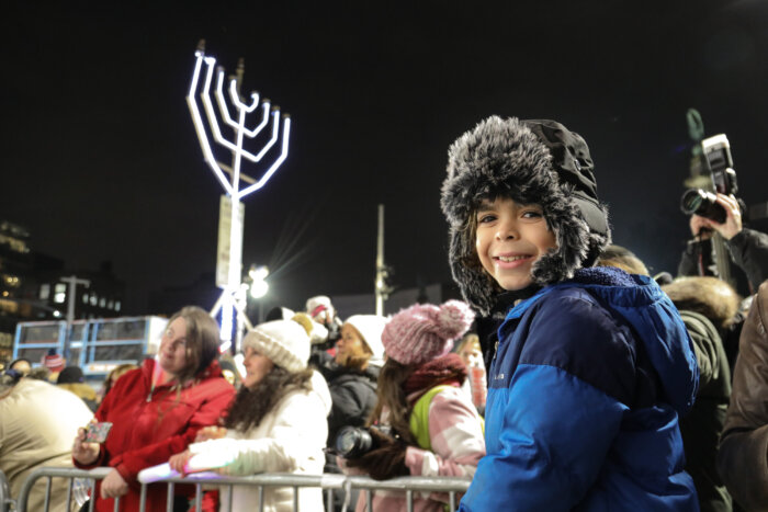 child at hanukkah celebration