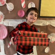 Kid with autism at Birch Family Servoces christmas gift drive