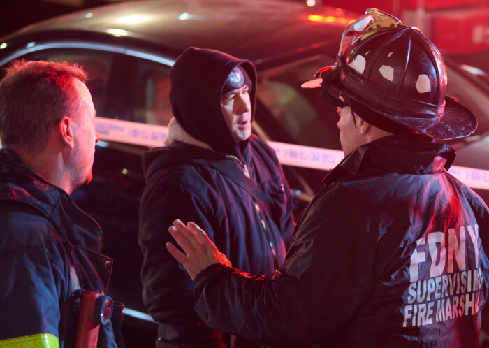 man with firefighter at greenpoint fire