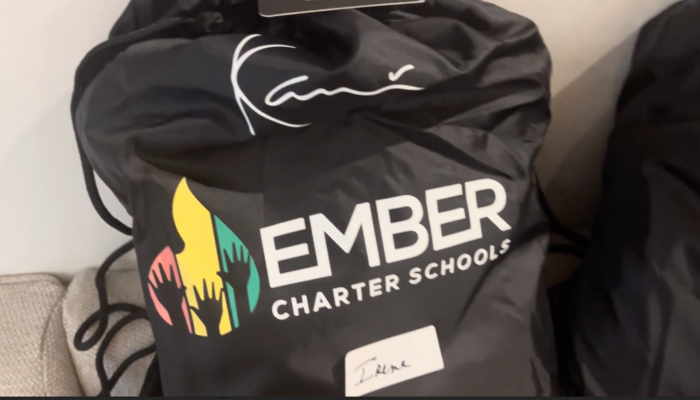 Students came out of class to a surprise celebration with their new fits and swag bags.