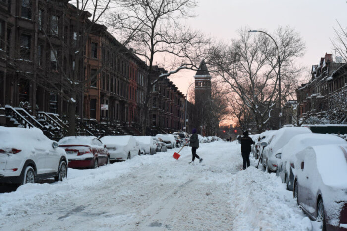 people in street in winter snow storm