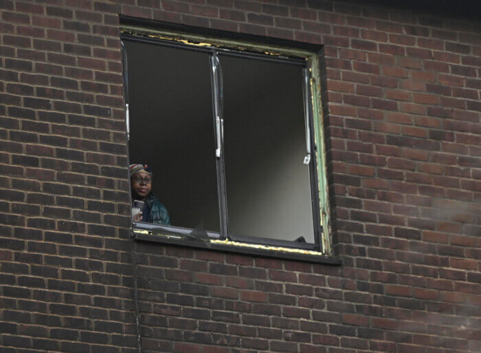 woman in window after east new york fire