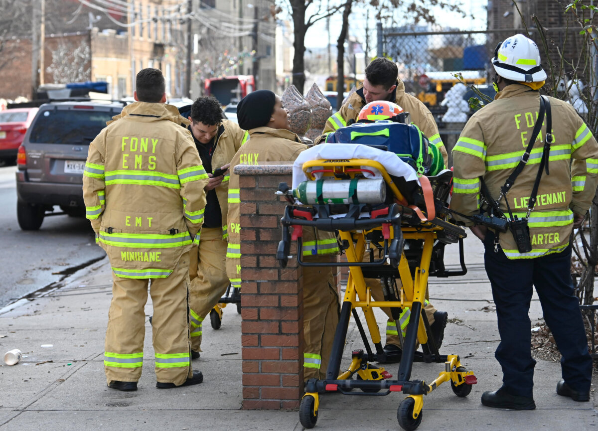 woman on stretcher after East New Yor fire