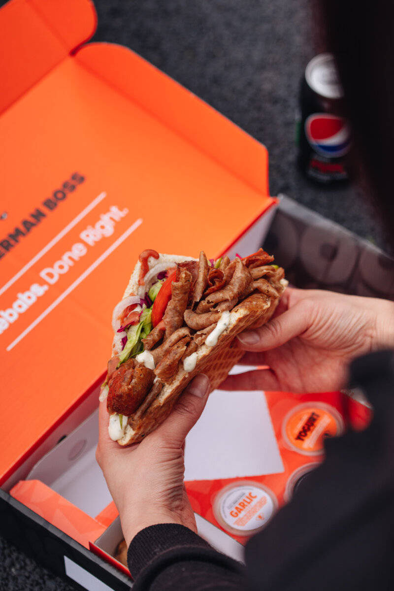 person eating German Doner Kebab