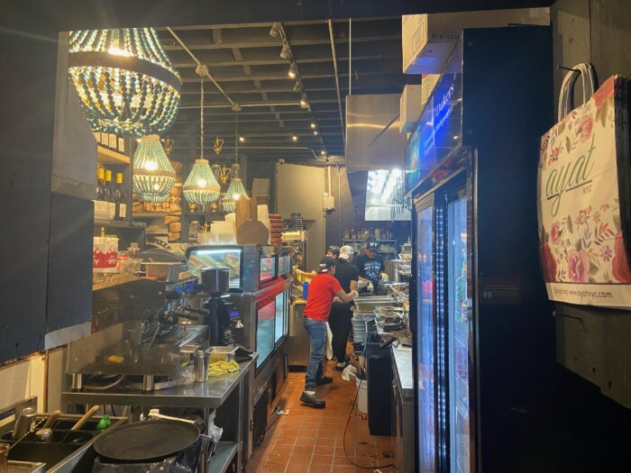 Kitchen staff at Ayat's Ditmas Park location preparing for Shabbat dinner.