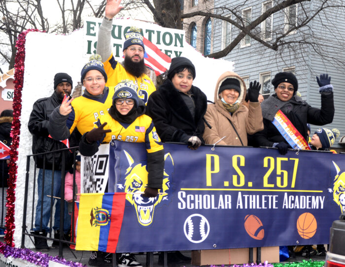 students on float at three kings day parade