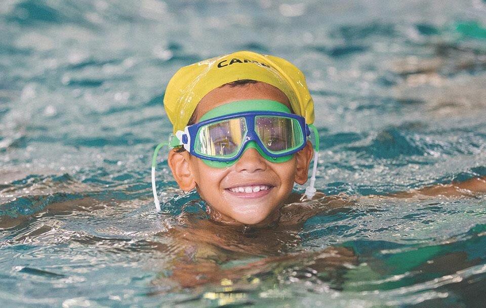 child at swimming lessons