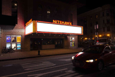 exterior of nitehawk cinema with sign