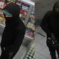 Two gun-wielding robbers stole thousands from a Crown Heights store.