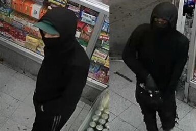 Two gun-wielding robbers stole thousands from a Crown Heights store.