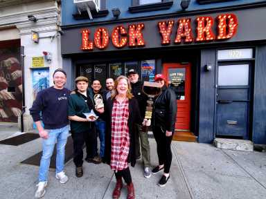 winner of lock yard chili eating contest posting outside restaurant
