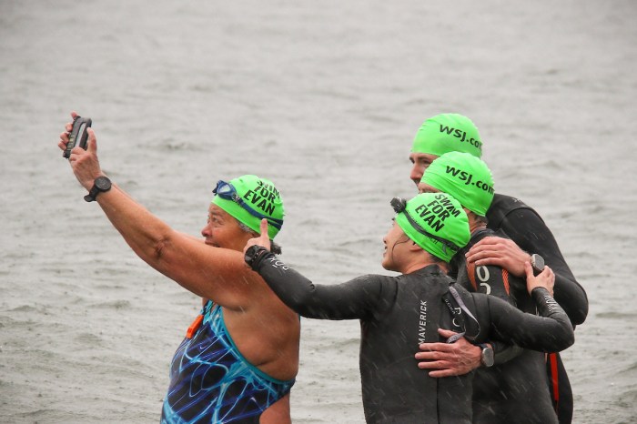 Swimmers mark one year anniversary of journalist's imprisonment with Brighton Beach plunge.