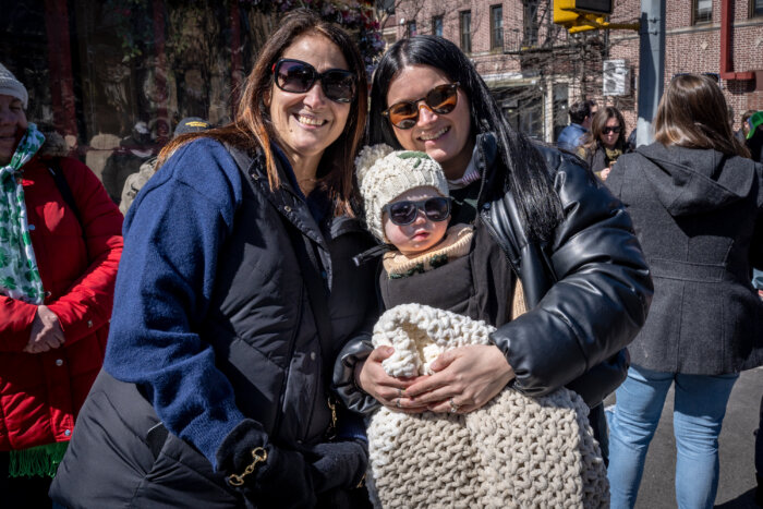 women with baby at st. patrick's day parade