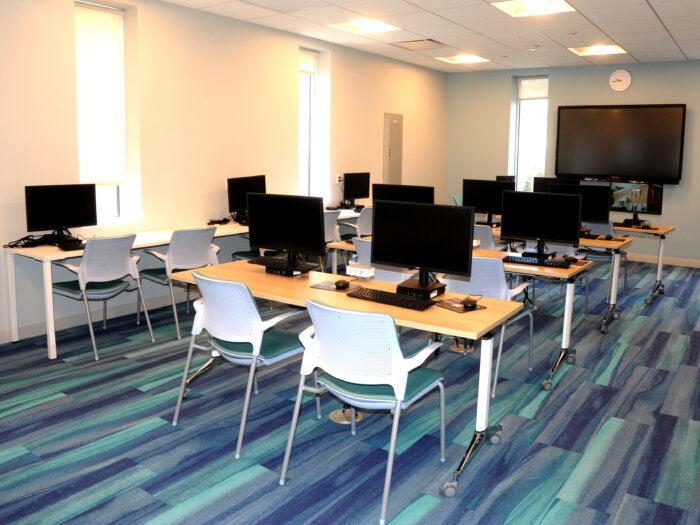 The new Bay Ridge Center at 15 Bay Ridge Avenue with a state-of-the-art computer and instructors.
