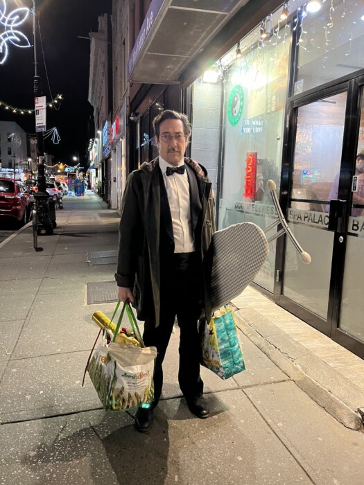 james hook outside with ironing board